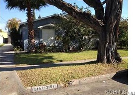 Front of main house 4 bedrooms 2 bathroom, 2 car garage, has rea