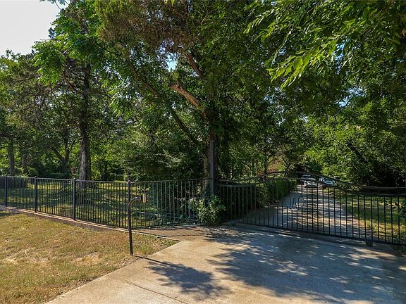 Enter this enchanting private estate through a control accessed gate.