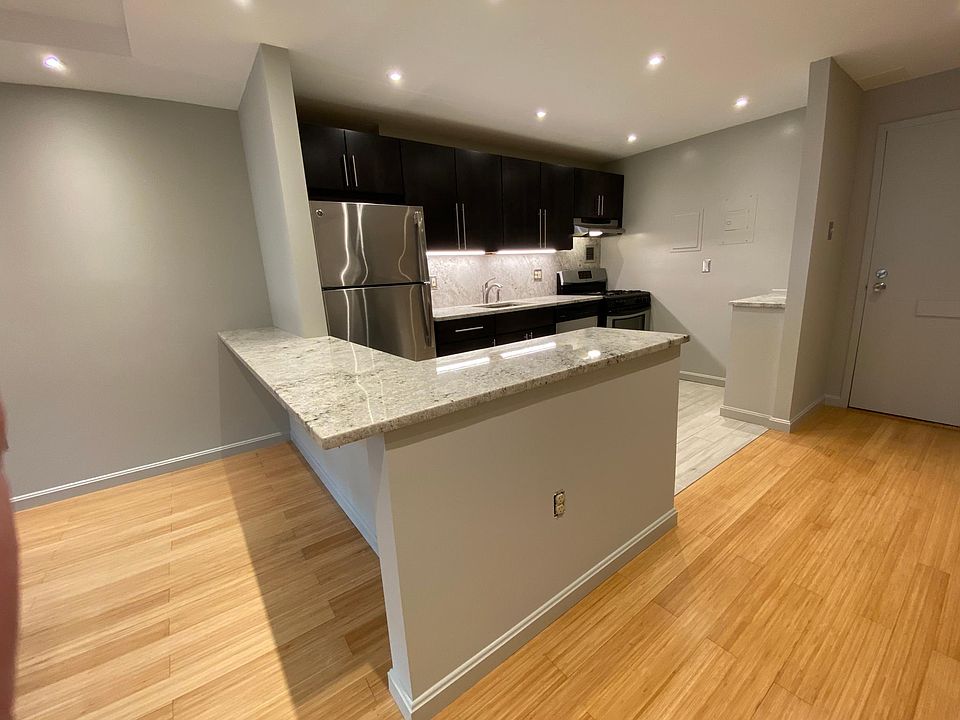 Built-in granite counter ideal for laptop, drinks, and dining.