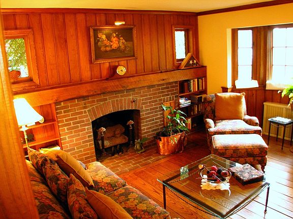 another view of living room with bay window & hardwood floors