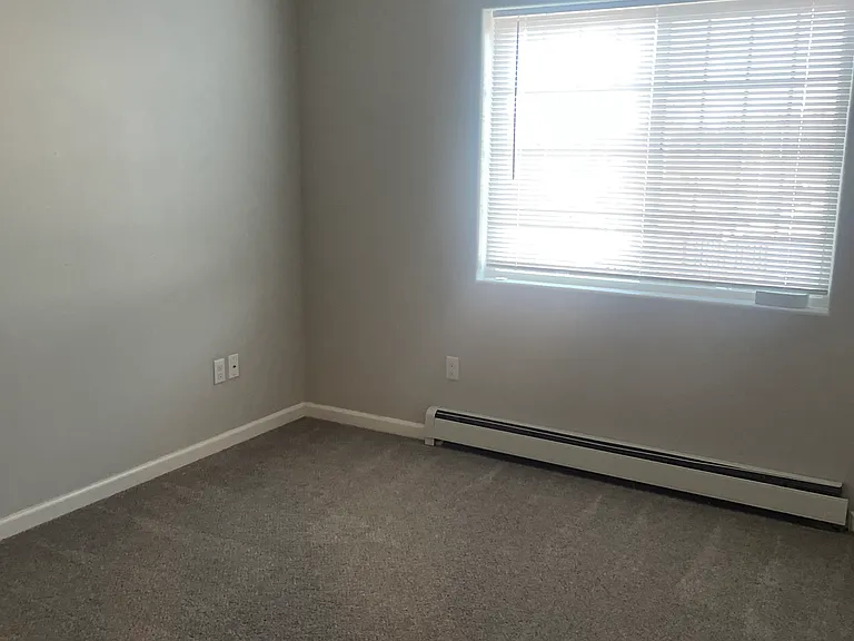 Spacious bedrooms with ceiling fans and miniblinds.