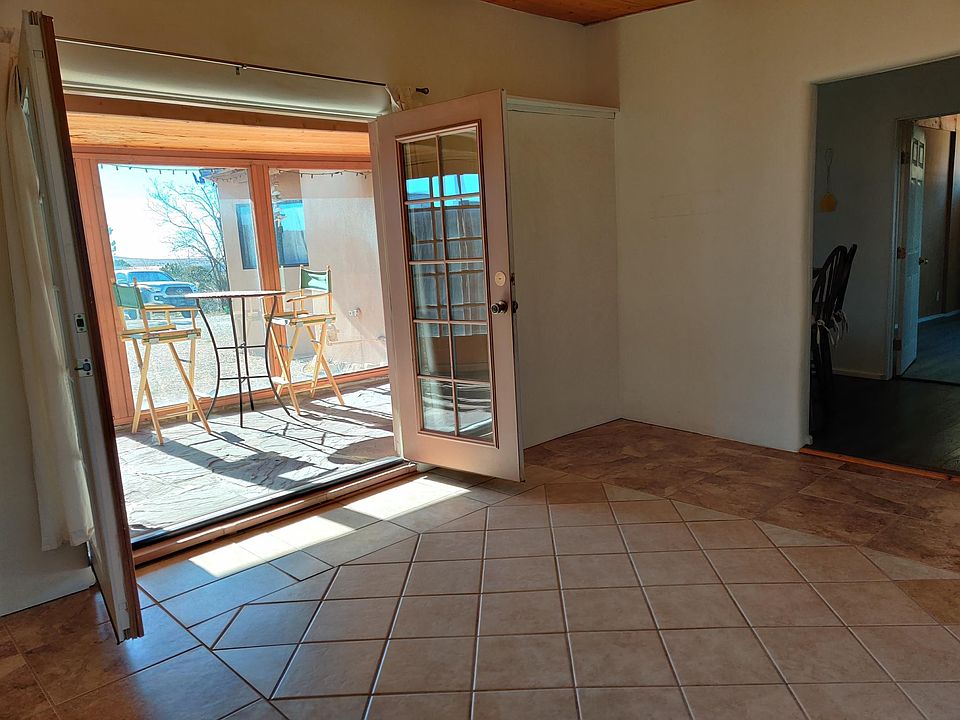 Living room looking into greenhouse.