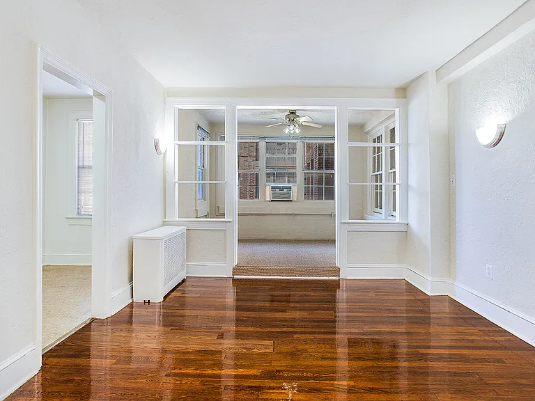 Living and sunroom (virtually staged)