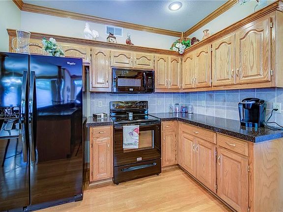 Mint condition, solid cabinetry, gently used appliances and ample work areas.