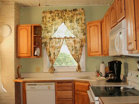 The kitchen has been updated and two windows make it bright and cheerful.