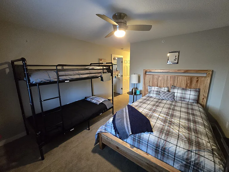 2nd bedroom with queen bed, bunk beds, and dresser. Plus a big screen TV with Roku.