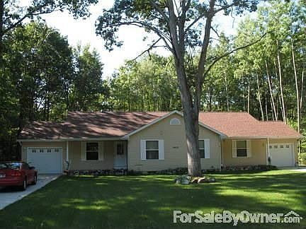 Front view from street
						:
						Landscaped yard, shrubs, green lawn, flowers and plenty of shade