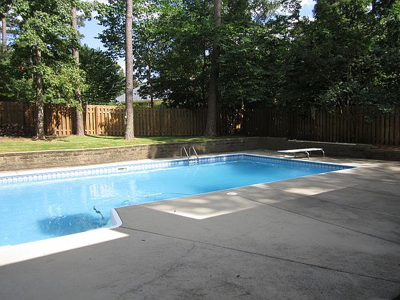 View from back door : Enjoy this fantastic patio, pool, and backyard for entertaining friends!