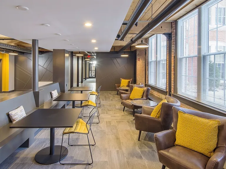 Lobby Seating With Tables And Leather Chairs.