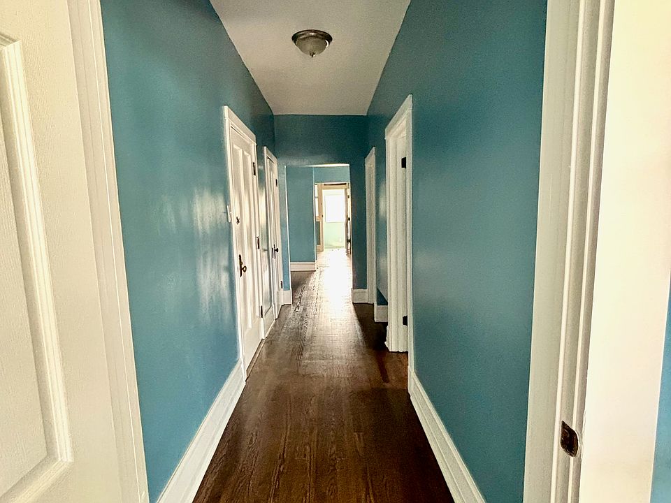 Entry hallway viewed from primary bedroom