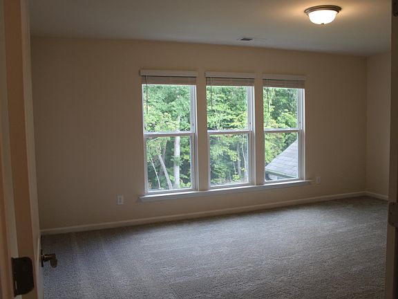 Master Bedroom with view into woods.