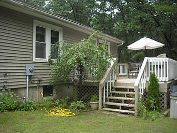 Conveniently located off the kitchen, the side deck area offers a private setting for entertaining, 