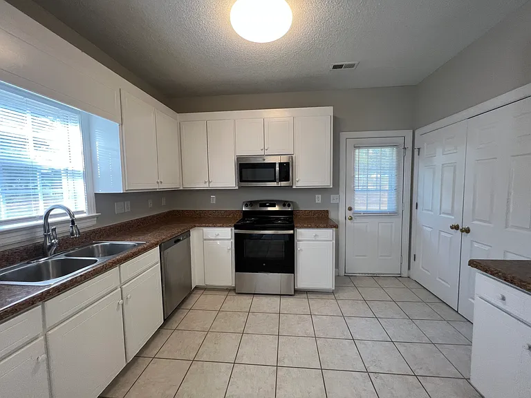 Kitchen... New Stainless Steel Refrigerator and NEW Stainless Steel Stove