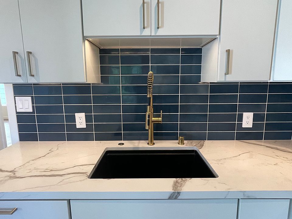 Kitchen sink with Heath ceramics tile backsplash