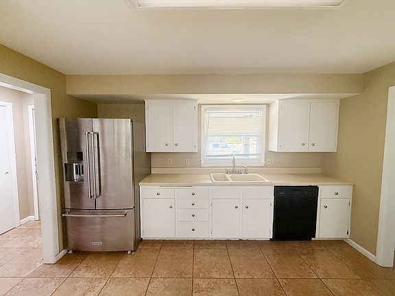 KITCHEN - REFLECTING FRIGIDAIRE AND DISHWASHER