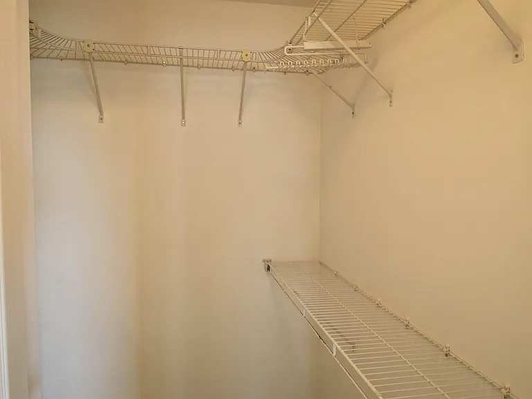 Walk-in closet inside the master bedroom