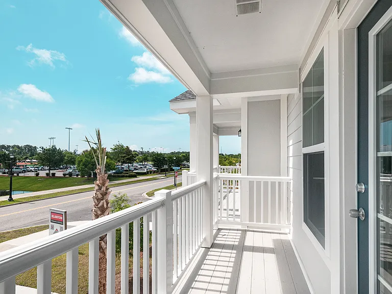 The balcony for this unit overlooks the community and the pond. Community is still under construction. This picture shows the balcony of the model unit.
