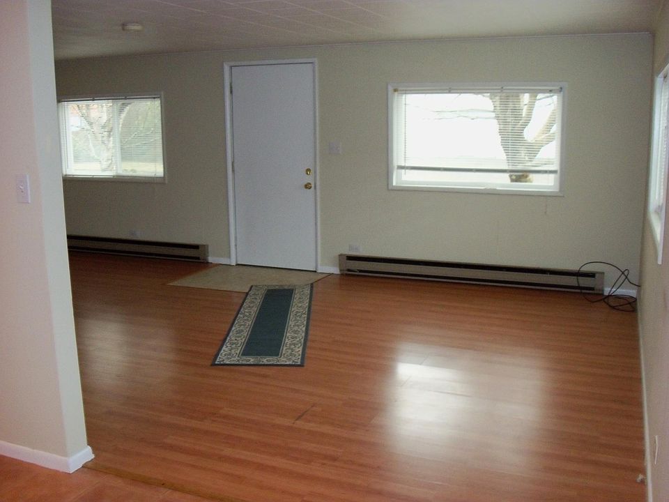 Front entry into living room. Kitchen is to the left.