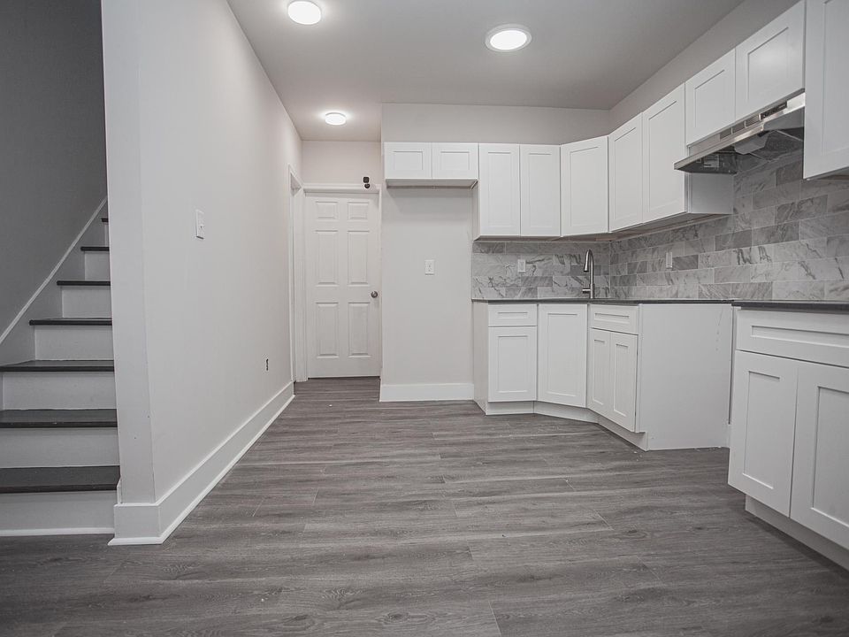 Kitchen includes a stove and fridge