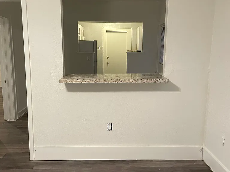 Bar overlooking dining room and kitchen