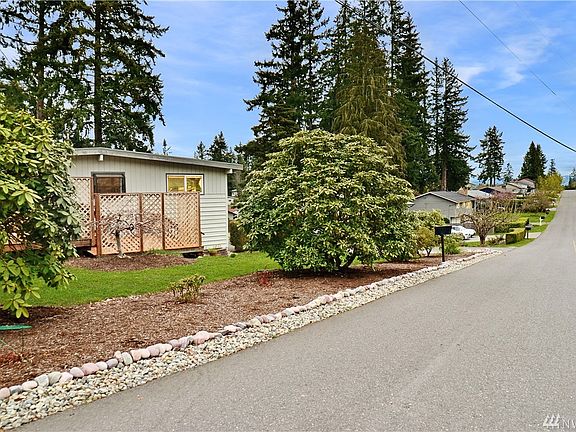 Corner of property with mountains seen at the end of the street
