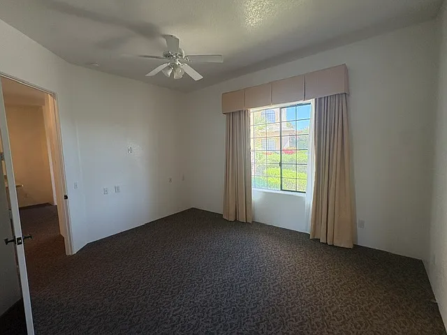 Spacious bedroom with oversized windows.
