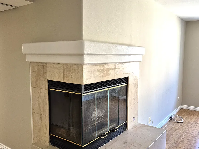 Marble corner fireplace in greatroom