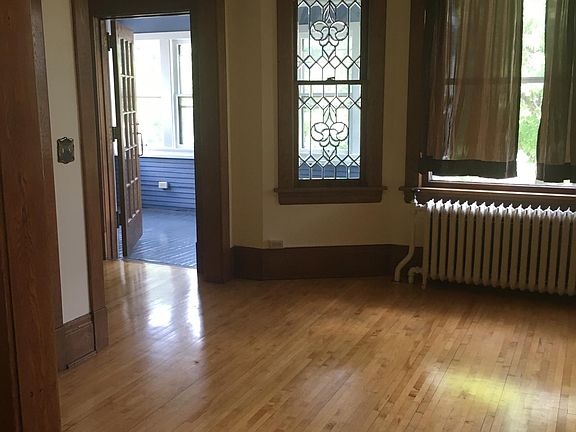 Second level with three season porch and beautiful windows and woodwork.
