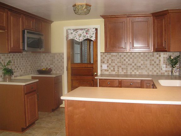 Brand new kitchen with corian bullnose edged countertops