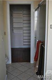 Walk-in closet is directly off of bath.