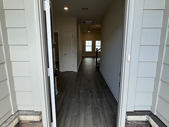starting at the front door you have laminate flooring in the foyer, great room, kitchen, dining roo