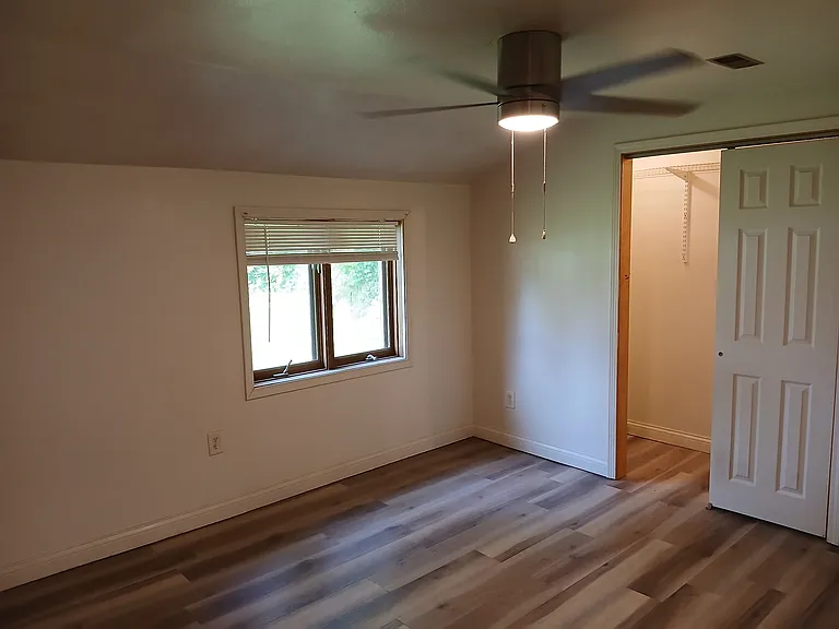 Both bedroomshave hardwo od floors.ceiling flans, twelve foot closets and thermopane windows,with blinds