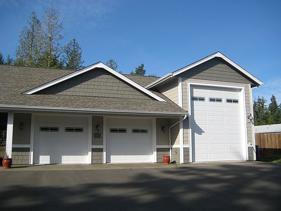 3 car garage features drive through RV parking