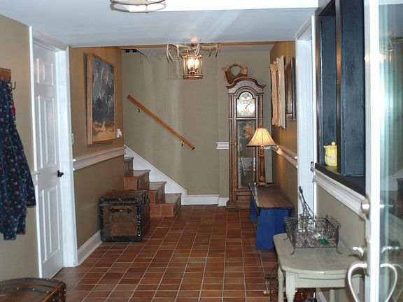 Downstair foyer with custom touches in stairwell