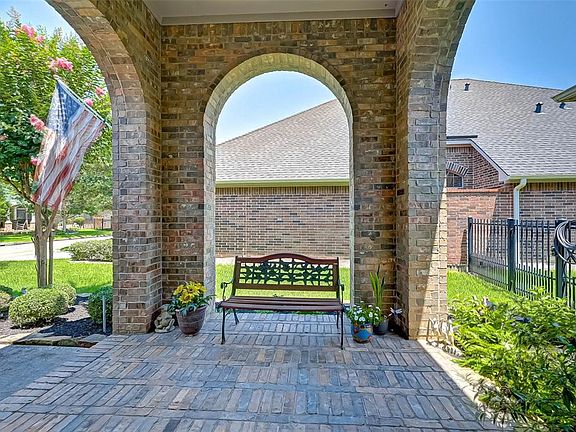 Covered sitting area to the left of front door