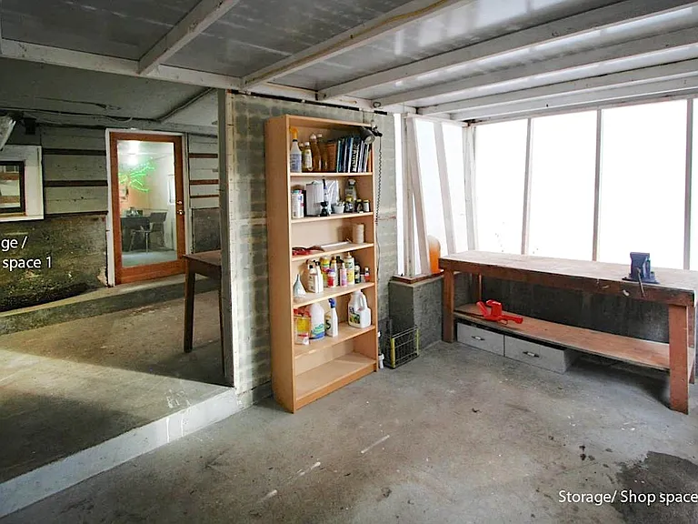 Additional storage/shop space #2 & # 1 (unheated) daylight basement. Adjacent to and with access to the back yard
