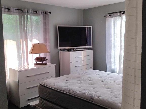 This is walking into the bedroom, with awesome huge windows.