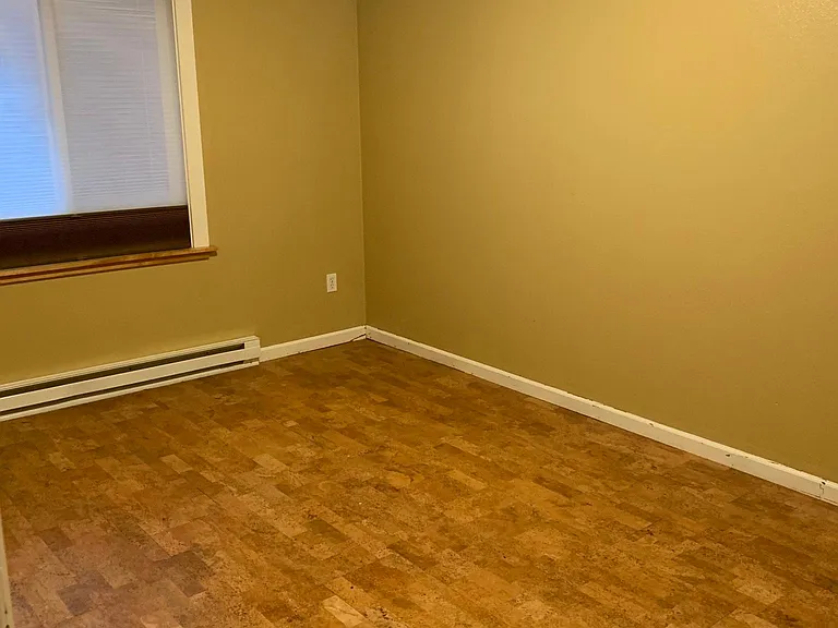 Upstairs bedroom, cork flooring, insulated black out/sheer window shades