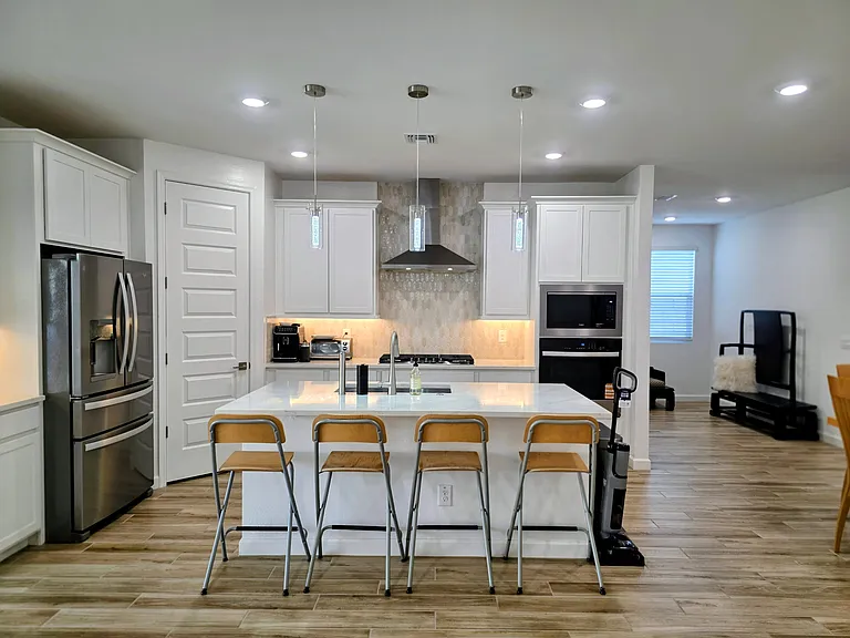 Larger corner pantry with 
-Phillips Espresso Machine
-Toast Oven
-Water filtration (hot/cold)
-Refrigerator, Microwave, Oven
-Dish washer