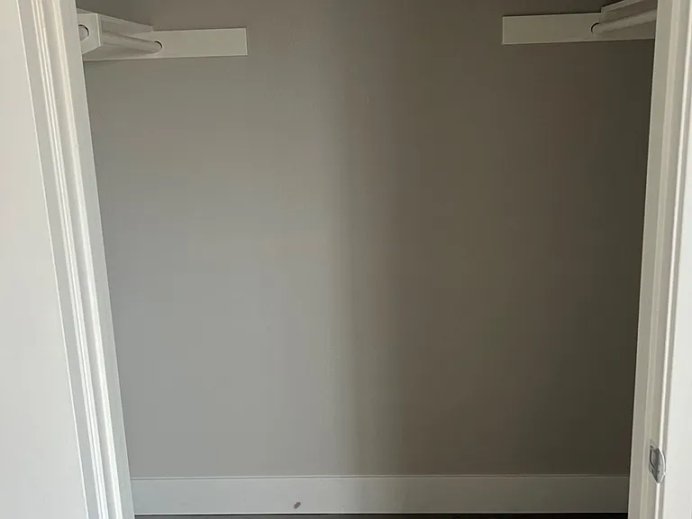 Large walk-in bedroom closet at IKARIA Apartments in Santee, California.