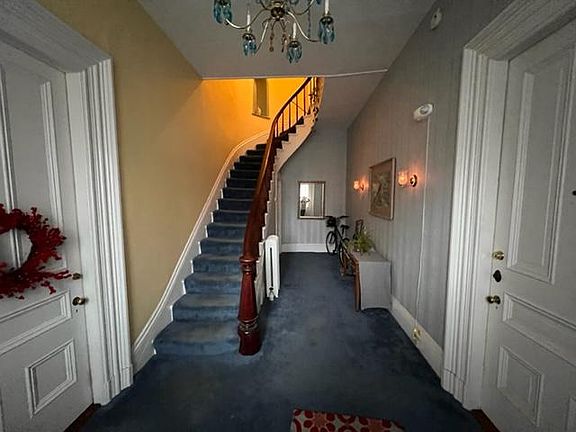 front hallway stairs leading up to apartment
