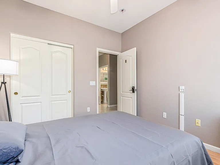 Full size bed, lamp, ceiling fan and light