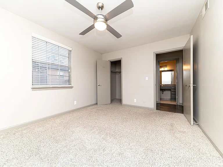 Bedroom with carpet & ceiling fan