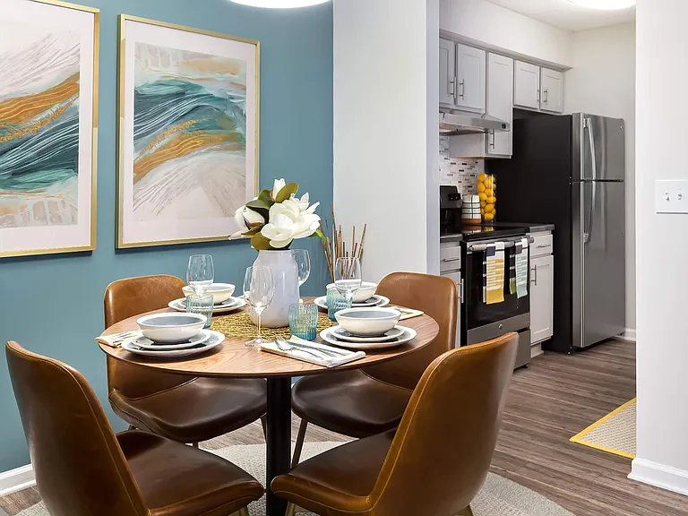 Dining Room featuring Accent Wall and Modern Light Fixture - Diamond Interior