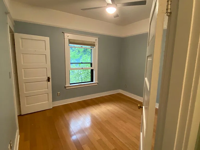 Bedroom with Modern Fan Company fixture.