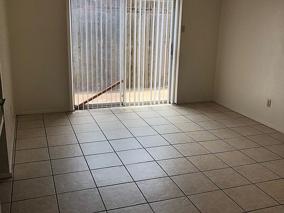 Living room opens to patio and fenced yard