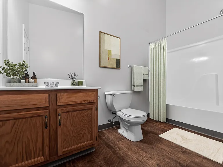 Welcome to a serene retreat at Mansions at Delmar, an Eagle Rock Community. This stylish bathroom features modern finishes, ample storage, and a calming atmosphere. Don't miss your chance to call this home. Schedule a tour today!