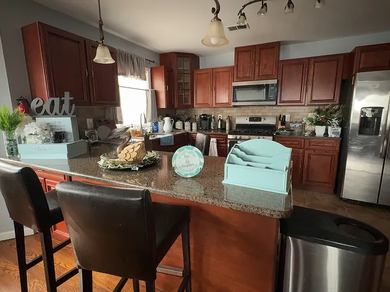 Kitchen island overlooking chef's kitchen.