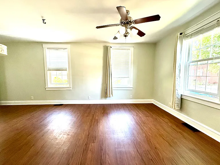 Front entry view of living room. Nice ceiling height on first and second level.