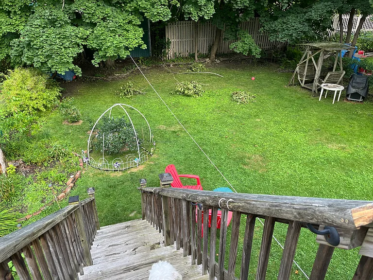 Stairs from balcony down to yard